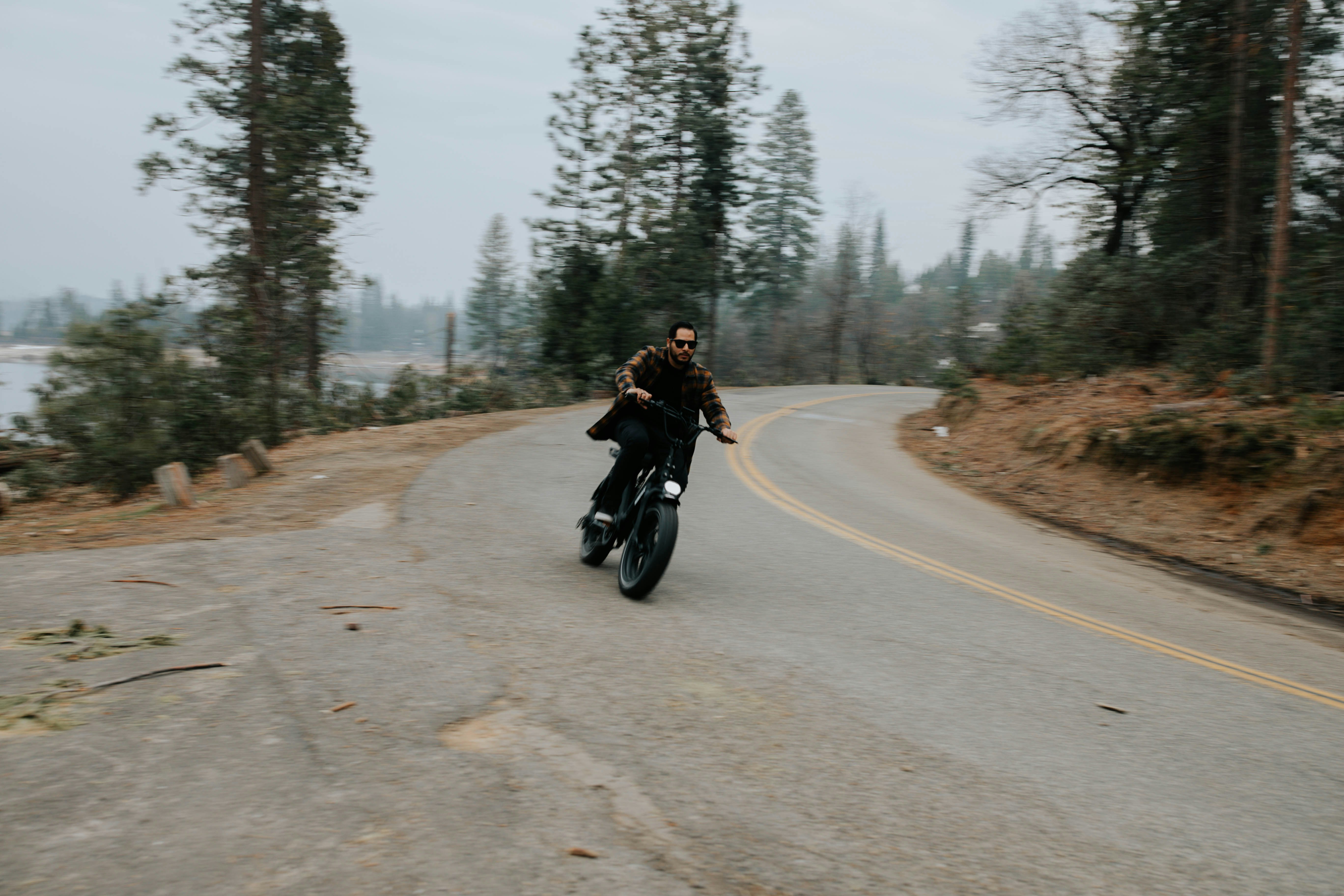 man riding motorcycle on road during daytime